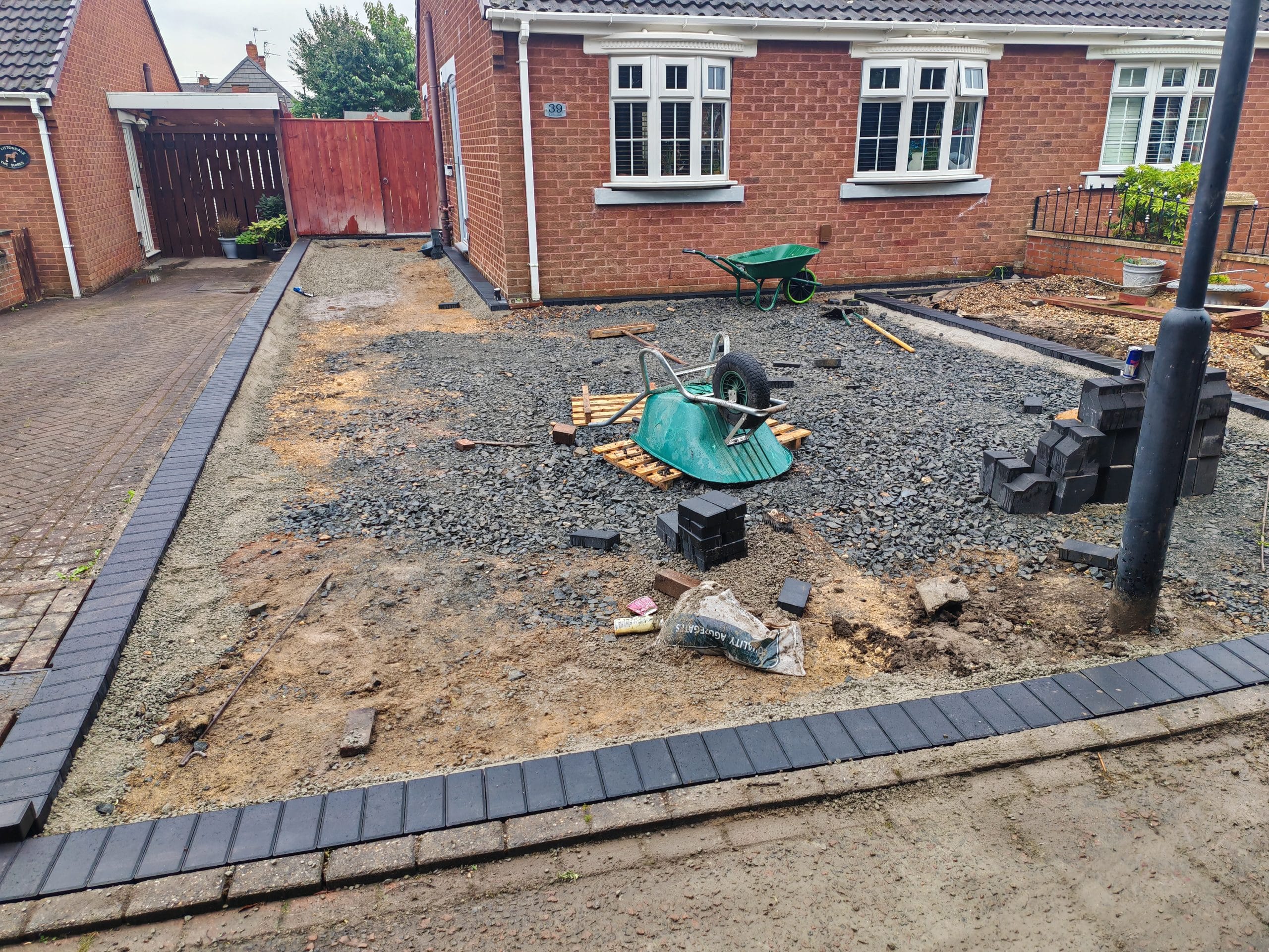 Charcoal block border laid on concrete