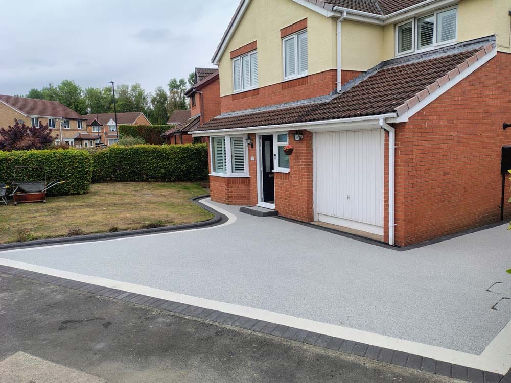 Azura blue Resin Driveway with an arctic white border
