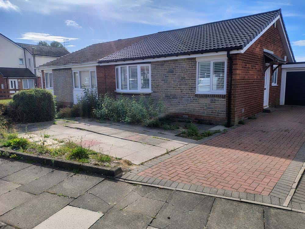 Daltex dark grey marble driveway with a granite border before